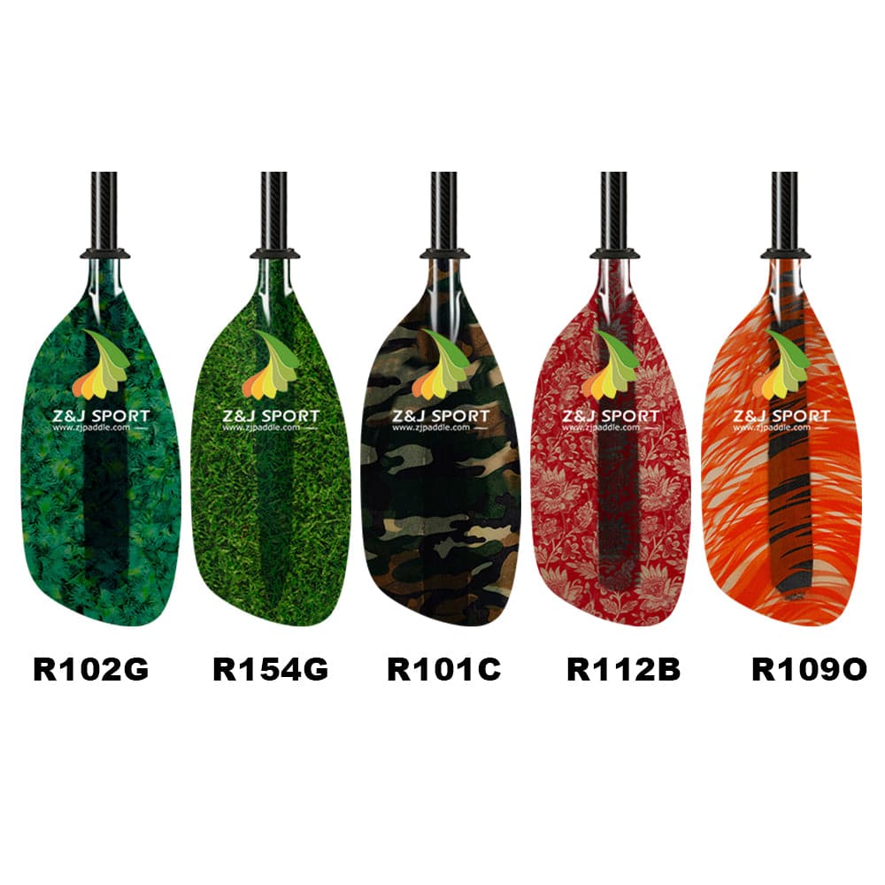 Five fiberglass kayak paddles featuring Z&J Sports logo and designs in green moss (R102G), vibrant green (R154G), camouflage (R101C), red floral (R112B), and orange tiger stripe (R109O) are lined up, each with unique, eye-catching patterns.