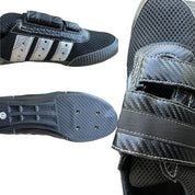 Close-up of ZJ SPORT black and silver carbon fiber-look rowing shoes featuring Velcro straps. One shoe showcases three silver stripes from the side, and the other reveals its textured grip on the sole. These ZJ High Quality Rowing Shoes are crafted for performance but are not waterproof.