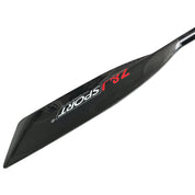 A close-up of a black carbon fiber paddle blade, labeled ZJ SPORT in red and white, designed for flatwater canoeing. The long, narrow ZJ Full Carbon Fiber Flatwater Canoe Paddle reveals a subtle texture against the white background.