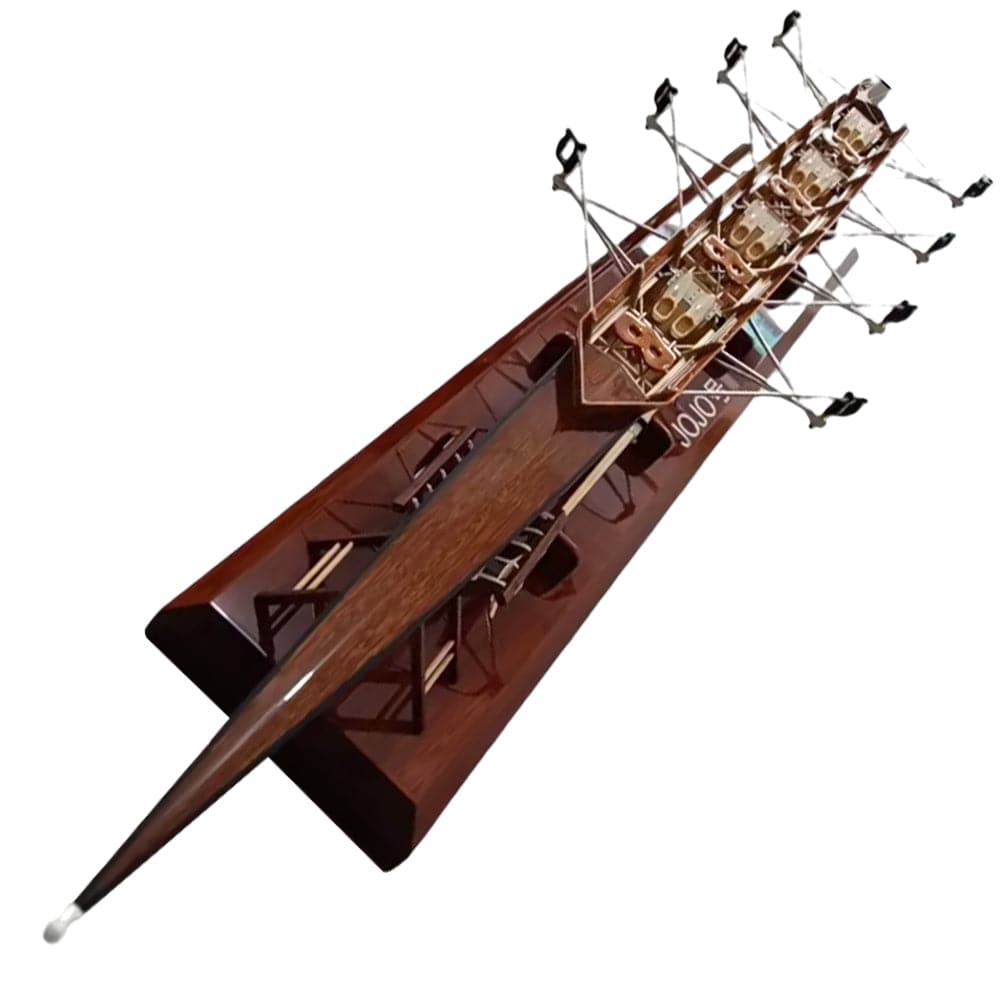 The ZJ Handcrafted Rowing Boat Model by zijie is a wooden coastal rowing boat miniature with six oars, a triangular front, and intricate rigging on a polished base, showcasing the craftsmanship and elegance of maritime vessels.