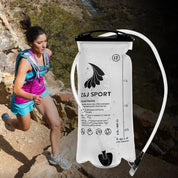 A woman in athletic gear runs on a rocky trail. In the foreground, theres a Z&J SPORT Hydration Bladder by zijie. The 2L bladder has a large opening and hose, volume markings, and is BPA-free for safe, easy hydration during outdoor activities.