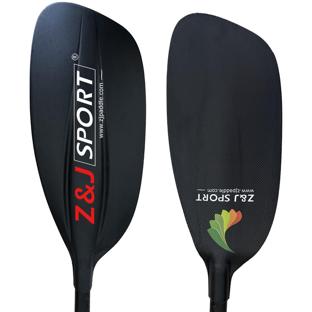Two black ZJ SG Carbon Whitewater Kayaking Paddles feature Z&J SPORT branding. The right paddle includes a colorful leaf logo and website URL. These sleek paddles have carbon fiber blades, all set against a white background.