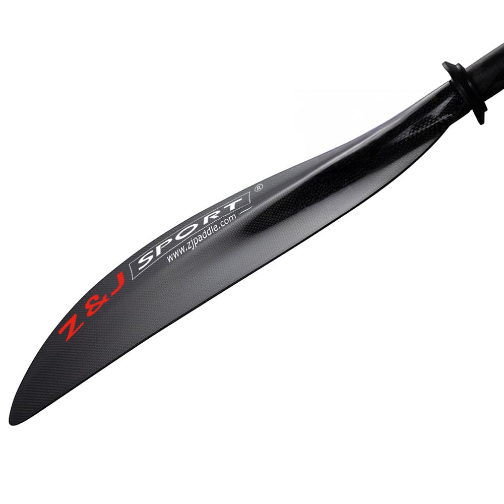 Close-up of black ZJ SPORT canoe paddle with asymmetrical carbon fiber blade featuring red and white Z&J SPORT logo. The precision design enhances long-distance paddling, with a circular grip near the top edge.