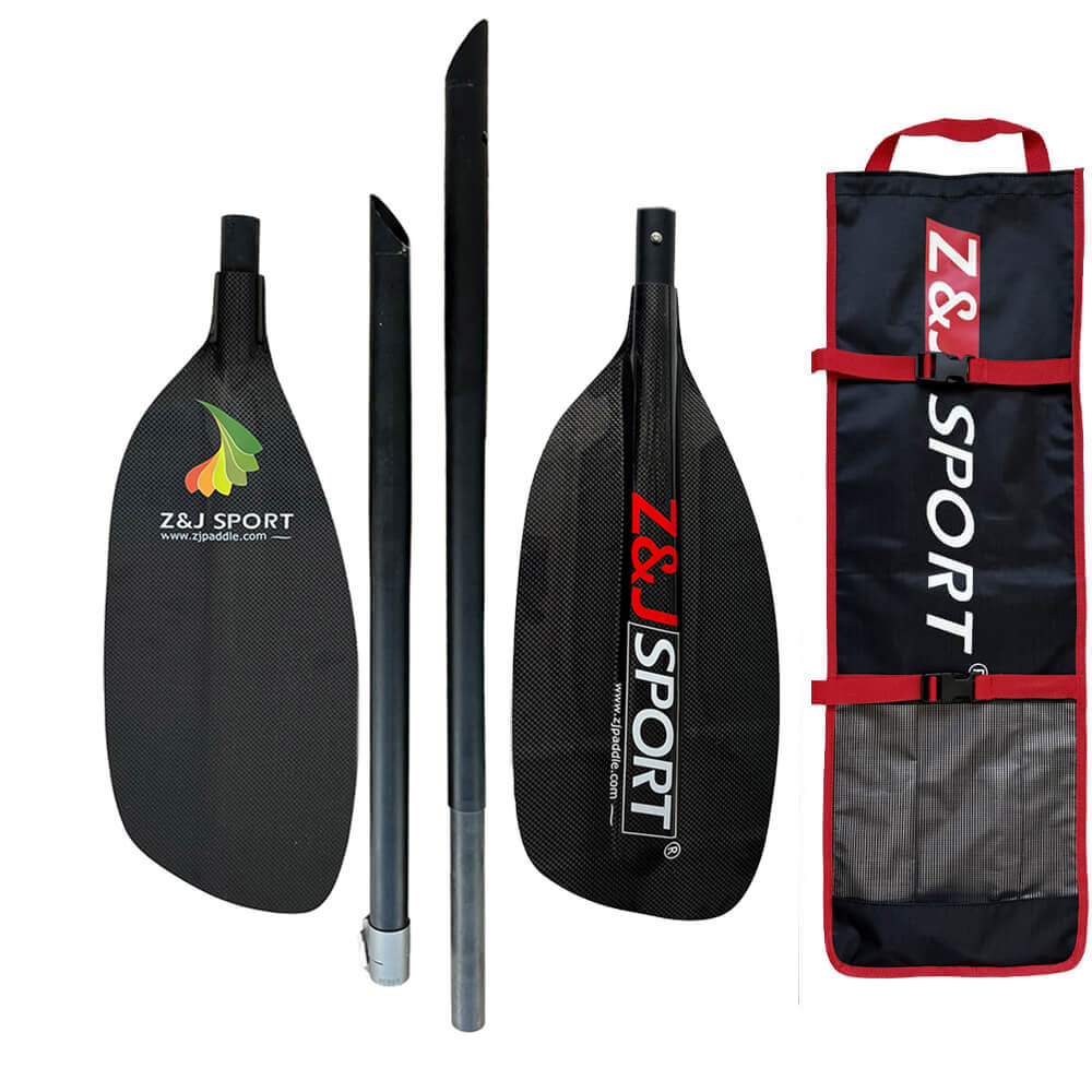 A disassembled black ZJ SPORT paddle includes a handle, two ends, and a shaft with Z&J SPORT on the carbon fiber blades. The set comes with a branded black and red carrying bag, ideal for whitewater paddling enthusiasts.
