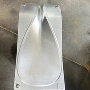 A close-up of zijies Mold Design (OEM Service) reveals a teardrop-shaped, silver metal mold crafted with advanced 5 Axis CNC Machining. It lays on a dark, scratched surface, boasting smooth curves and a polished finish that accentuates its intricate design.