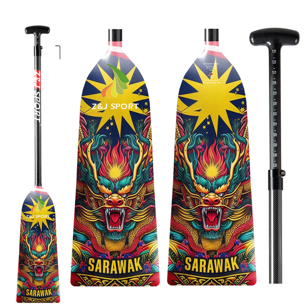 Crafted from full carbon fiber, the ZJ SPORT dragon boat paddles showcase a fierce dragon design with a vibrant yellow starburst, labeled SARAWAK. The paddles are IDBF approved and come with an adjustable length black handle.