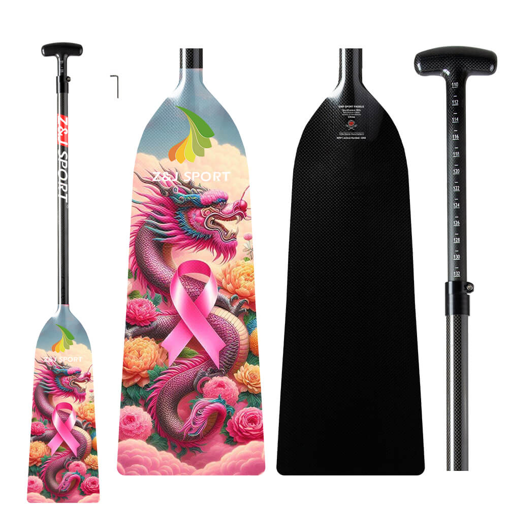 The ZJ SPORT ZJ IDBF Approved Carbon PINK Series Dragon Boat Paddle features a vivid dragon design with a pink ribbon and floral accents. The handle has an adjustable measurement guide, combining style and functionality in its striking carbon fiber build.