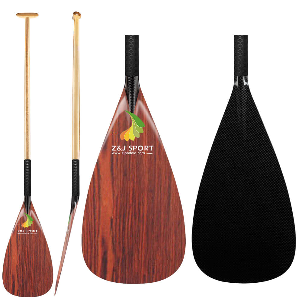 The image showcases the ZJ Hybrid Outrigger Canoe VAA Paddle by ZJ SPORT, featuring a wooden veneer on a carbon blade with an anti-skid grip. It presents front, side, and back views of the paddle adorned with a leaf and Z&J SPORT logo.