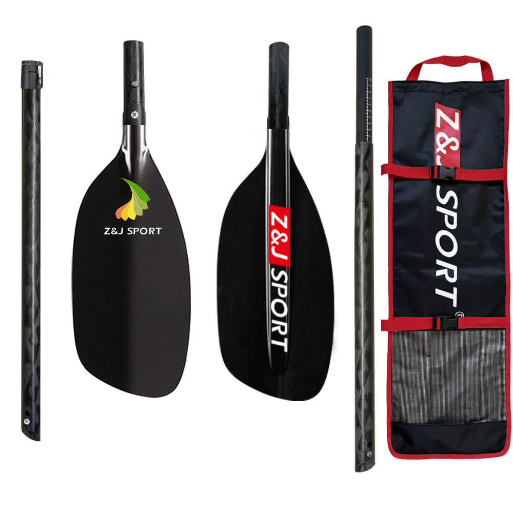 A disassembled black ZJ SPORT paddle includes a handle, two ends, and a shaft with Z&J SPORT on the carbon fiber blades. The set comes with a branded black and red carrying bag, ideal for whitewater paddling enthusiasts.