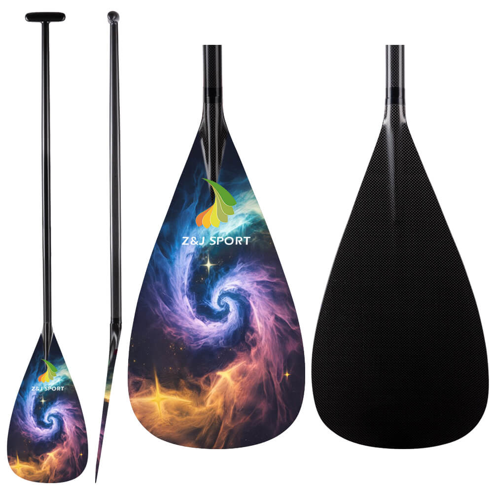The ZJ SPORT Full Carbon Outrigger Canoe VAA Paddle showcases a vibrant cosmic swirl design on its blade. Crafted with precision, this paddle offers an ergonomic T-handle for comfort and performance, proudly featuring the ZJ SPORT branding.