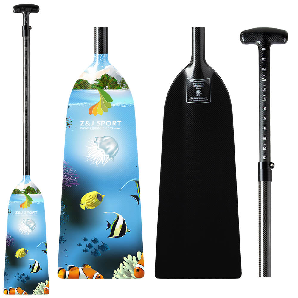 Two kayak paddles are shown: a ZJ SPORT carbon fiber paddle with an ocean-themed design of fish and coral on blue, and a solid black one with a textured grip. Both have adjustable shafts for versatility.