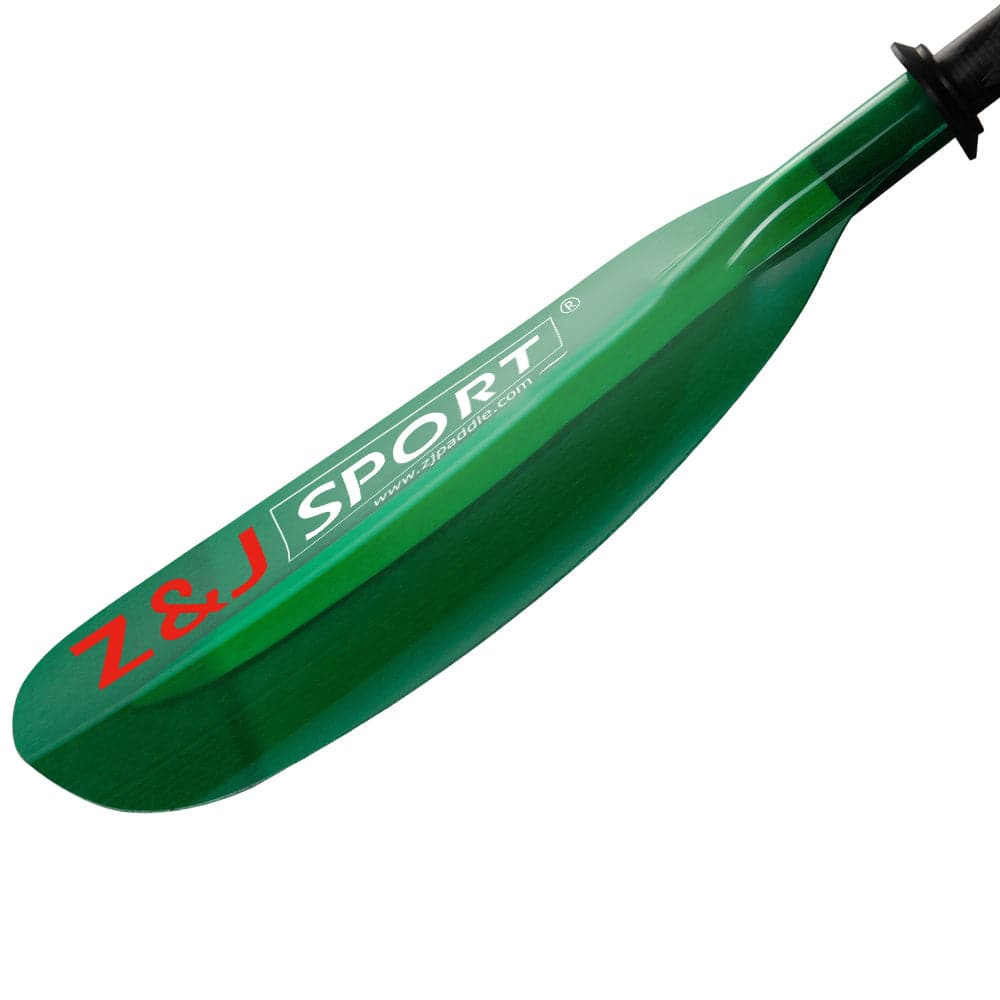 Close-up of the ZJ SPORT kayak paddle blade with Z&J SPORT printed in white and red, featuring a translucent fiberglass blade at an angle and a carbon fiber shaft—ideal for seakayak adventures.