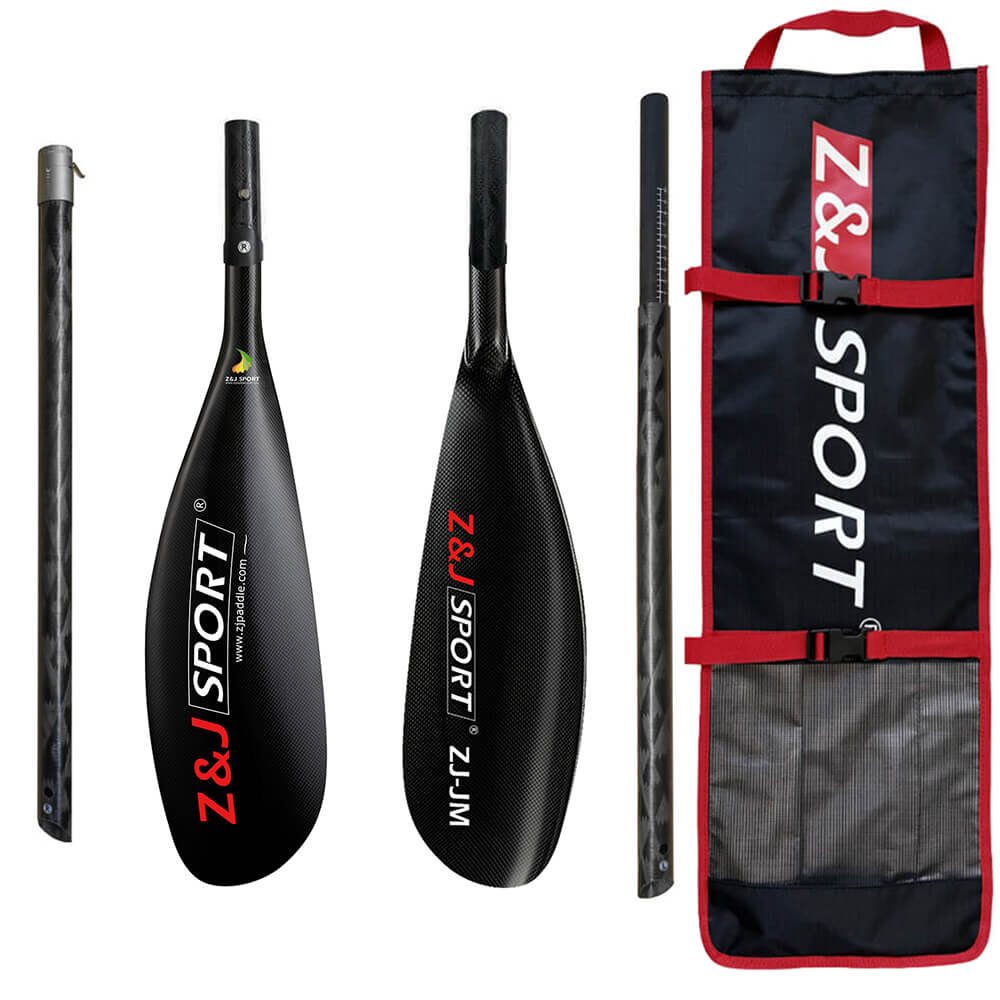 The ZJ 4 Piece Carbon Fiber Kayak Surfski Paddle features black carbon fiber with the Z&J SPORT logo in red and white. It includes an adjustable oval shaft, wing blade, and a black carrying bag featuring a matching logo and red accents.