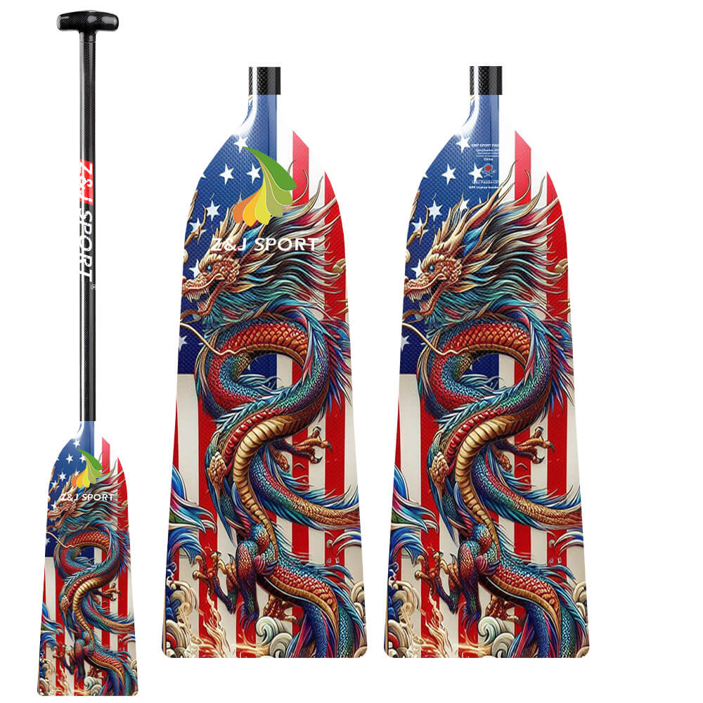 The ZJ Adjustable Carbon Dragon Boat Paddle, approved by IDBF, features vibrant dragon designs over an American flag, adjustable lengths, blue tips, and red stripes. Branded ZJ SPORT, these paddles form part of the Custom Series Graphics.
