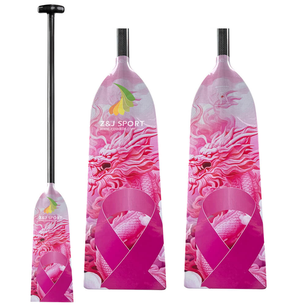 Three pink ZJ SPORT IDBF Approved Carbon PINK2 dragon boat paddles, featuring vibrant designs with a prominent pink ribbon symbol and adjustable lengths, come with black handles. The paddles are showcased against a plain white background.