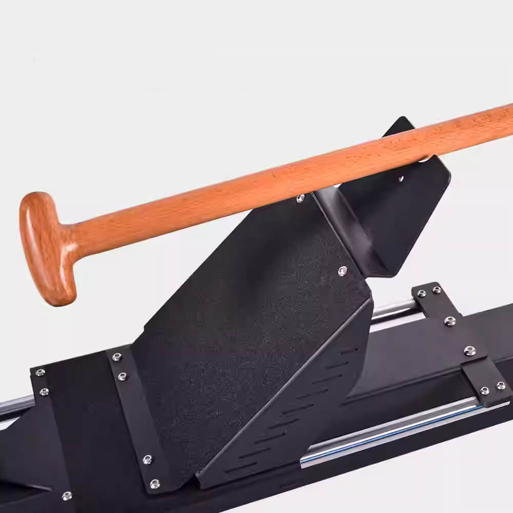 A close-up of the Gym Fitness Equipment Heavy Duty Rowing Machine by zijie shows a sleek black sled-like design with a wooden handle, inclined footrest, and metal rails for smooth movement. Perfect for strength training and fitness exercises.