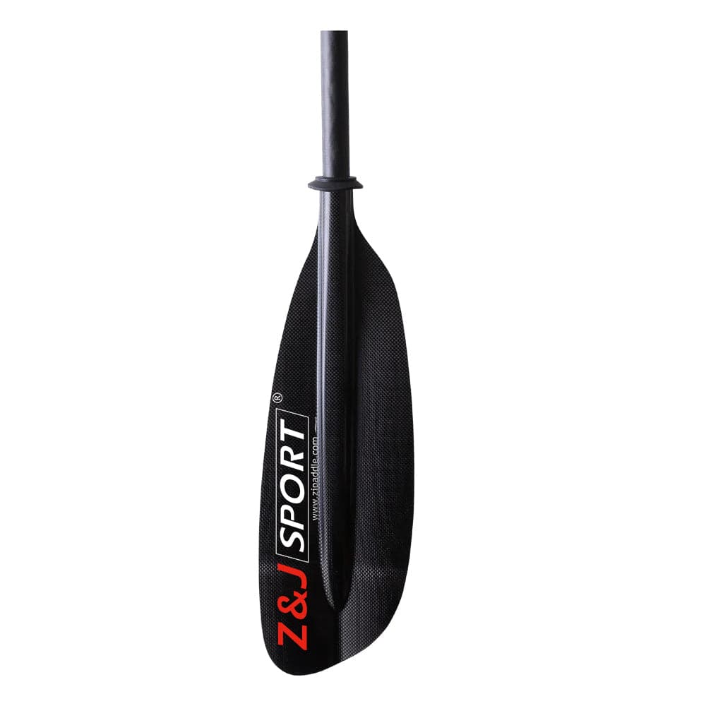 A close-up of the ZJ 2 Piece / 4 Piece Carbon Fiber Sea Kayak Paddle reveals its black, asymmetrical blade with a flat carbon fiber finish. The ZJ SPORT logo is displayed in red and white, and its sleek glossy shaft makes it ideal for long-distance paddling.