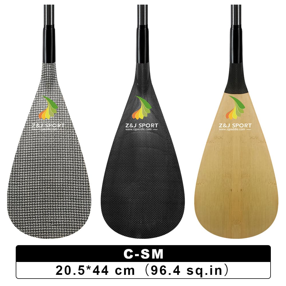 Displayed vertically are three ZJ SPORT waka ama paddle blades in houndstooth, carbon fiber black, and natural wood finishes. Each features the logo and comes with an adjustable shaft. The blades measure C-SM 20.5*44 cm (96.4 sq.in) and are designed for kids under the product name ZJ Adjustable Carbon Outrigger Canoe Paddle With C-SM Carbon Blade.