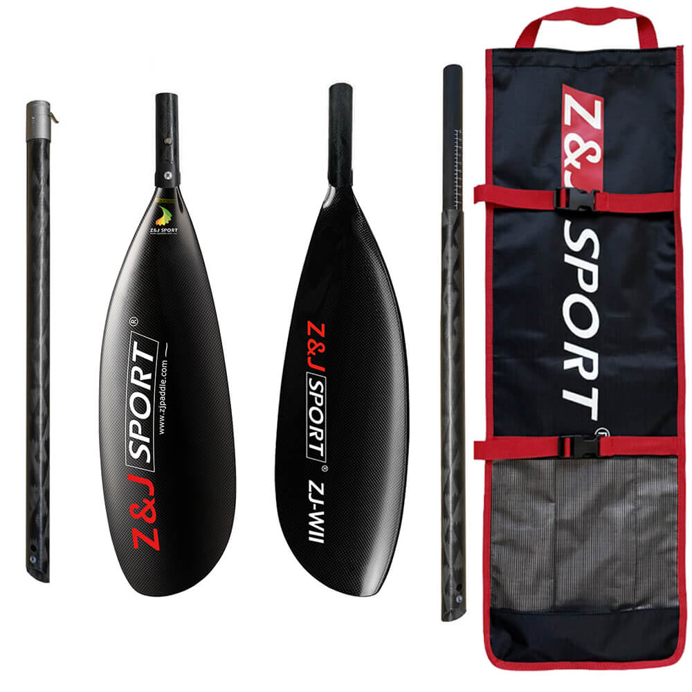 The ZJ 4 Piece Carbon Fiber Kayak Surfski Paddle, in black and red, showcases a sleek wing blade design. It includes two blades, an oval shaft, and a carrying bag with red trim featuring the brand logo.