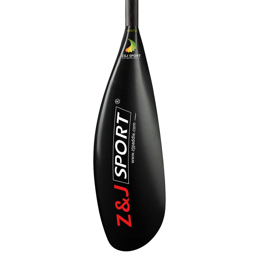Close-up of a black ZJ X Series Carbon Fiber Kayak Surfski Paddle blade, featuring Z&J SPORT and www.zjpaddle.com in bold red and white. This paddle has a sleek asymmetrical design with a slightly curved reinforced edge for enhanced durability.