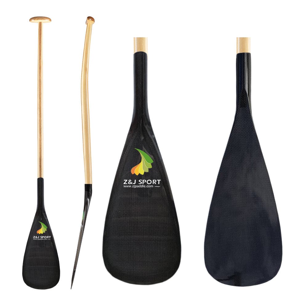 The black ZJ Hybrid Outrigger Canoe Paddle by ZJ SPORT features a handcrafted wood shaft with a colorful leaf design, showcasing Z&J SPORT on the carbon blade. The first view shows the whole paddle, the second presents a side angle, and the third highlights its carbon blade.