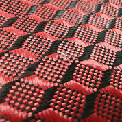A close-up of the ZJ New Black 3K Carbon Fiber Fabric Cloth by ZJ SPORT features a red and black woven pattern with interlocking hexagonal shapes, reminiscent of carbon cloth, ideal for specialized packing solutions. Dimensions: 1m x 5m. [Free Shipping].