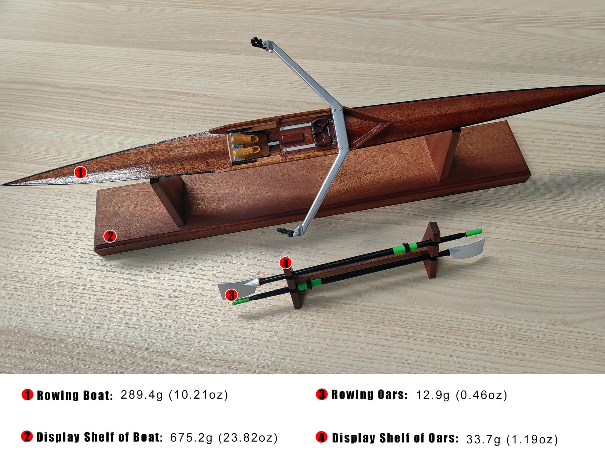 The ZJ Handcrafted Wooden Rowing Boat Model Miniatures by zijie are showcased beautifully with oars, featuring precise craftsmanship. Measurements include: boat 289.4g, display shelf 675.2g, oars 12.9g, and oar display shelf 33.7g—a tribute to classic rowing boats in an exquisite gift box.