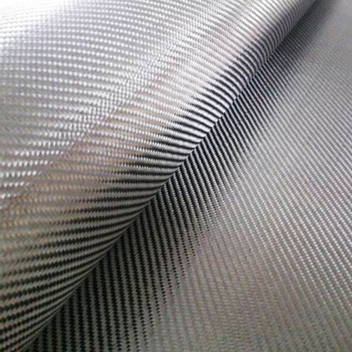 A close-up of the ZJ New Black 3K Carbon Fiber Fabric Cloth from ZJ SPORT shows its detailed diagonal weave pattern. The smooth, metallic finish reflects light, emphasizing its texture and durability, ideal for advanced packing solutions. Available in size 1m*5m with free shipping.
