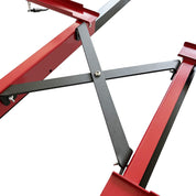 Close-up of ZJ SPORTs red metal frame with black diagonal brace in an X shape, showcasing the robust construction and connection points of high-quality steel pipes. This is part of the ZJ Updated New Sliding Base For Indoor Rowing Machine (2pcs/set, MOQ:5 sets).