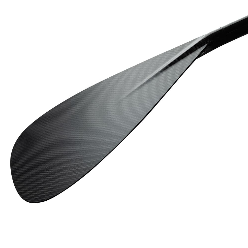 A close-up of the ZJ SPORT Hybrid Outrigger Canoe Paddle showcases its sleek carbon blade design, with a subtly textured surface and a handcrafted wood shaft partially visible, set against a white background.