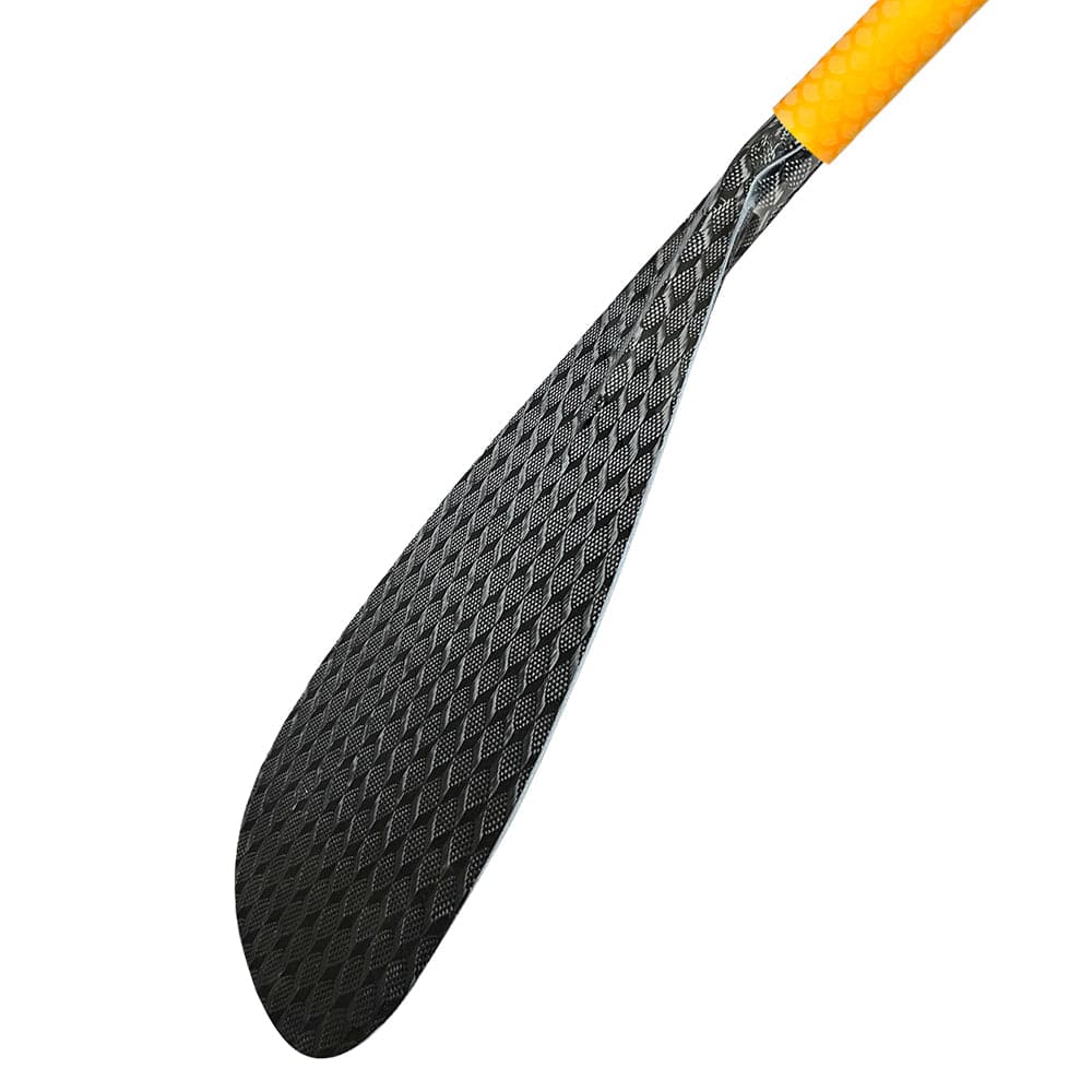 A close-up showcases the ZJ New Hybrid Outrigger Canoe Paddle by ZJ SPORT, featuring a textured black carbon blade with an oval shape. The paddle connects to a partially visible orange-tinted upper bent wood shaft with an anti-skid grip, highlighting the intricate design.