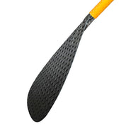 A close-up showcases the ZJ New Hybrid Outrigger Canoe Paddle by ZJ SPORT, featuring a textured black carbon blade with an oval shape. The paddle connects to a partially visible orange-tinted upper bent wood shaft with an anti-skid grip, highlighting the intricate design.