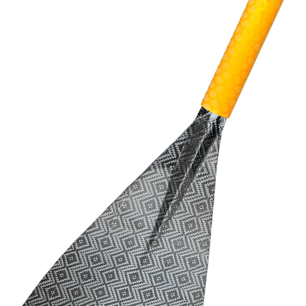 A close-up of the ZJ SPORT Hybrid Outrigger Canoe Paddle showcases its carbon blade with a diamond pattern and yellow textured anti-skid grip. The paddles sleek design of lightweight, durable materials stands out against the white background.